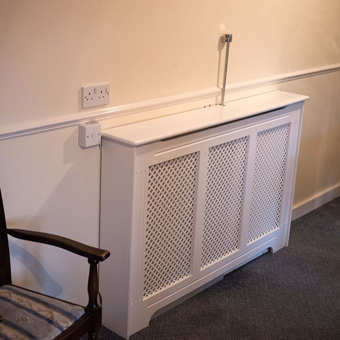personal protection system behind a radiator cover